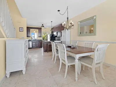 a kitchen and dining room with a table and chairs at Seagrove Dunes #1 in Seagrove Beach