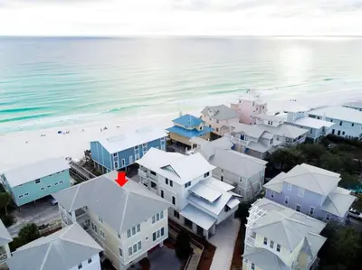 an aerial view of a beach with buildings and the ocean at All Decked Out 30A in Seagrove Beach