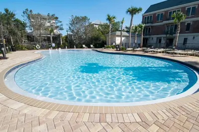 a large swimming pool with blue water at Village Of South Walton #403E in Rosemary Beach