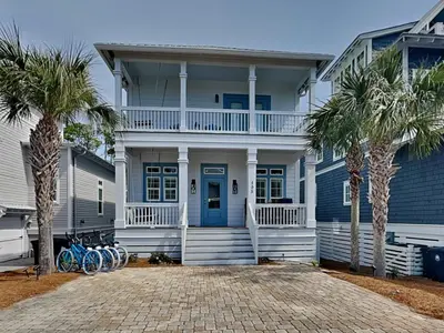 a house with bikes parked in front of it at Casa Migos in Rosemary Beach