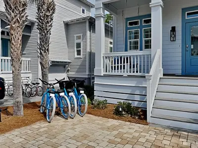a group of bikes parked outside of a house at Casa Migos in Rosemary Beach