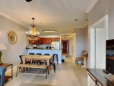 a dining room and kitchen with a table and chairs at Village Of South Walton #263A in Rosemary Beach