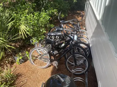 a row of bikes parked next to a wall at Sand Piper in Seacrest