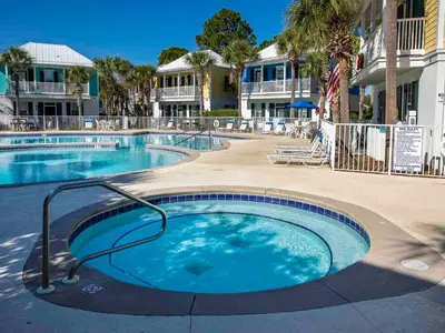 a large swimming pool in front of a resort at Bungalows at Seagrove #138 in Seagrove Beach