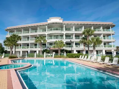 a hotel with a swimming pool in front of a building at Inn at Seacrest #206 in Rosemary Beach