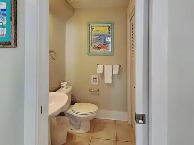 a bathroom with a toilet and a sink at Bungalows at Seagrove #142 in Seagrove Beach