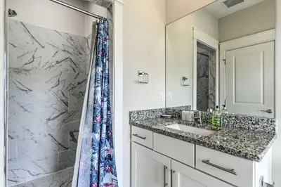 a bathroom with a sink and a shower at Inlet Beach Cottage Close to Beach Access! in Inlet Beach