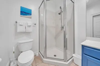 a bathroom with a shower and a toilet and a sink at Legacy 506- The Coastal Gem in Santa Rosa Beach
