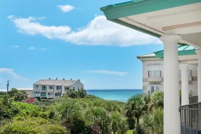 a view of the ocean from the balcony of a resort at Legacy 506- The Coastal Gem in Santa Rosa Beach