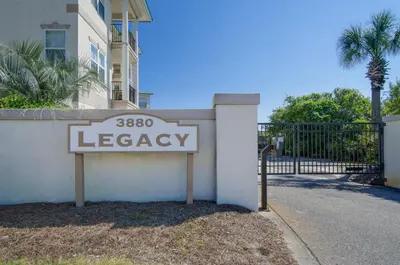 a sign that says egoagency in front of a building at Legacy 506- The Coastal Gem in Santa Rosa Beach