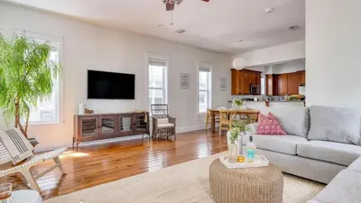 a living room with a couch and a table at Chic 30A Beach Home Views Ping Pong 5-Min Walk to Carillon Beach Bellview in Sunnyside