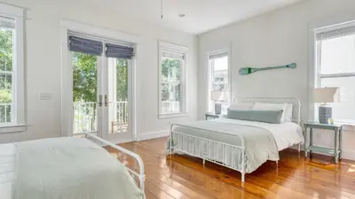 a white bedroom with two beds and windows at Chic 30A Beach Home Views Ping Pong 5-Min Walk to Carillon Beach Bellview in Sunnyside