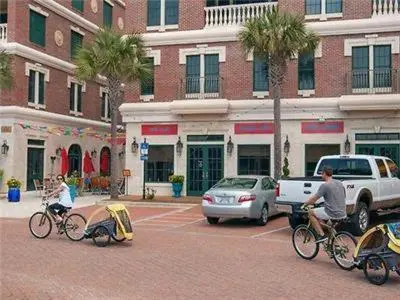 a group of people riding bikes in a parking lot at Village of South Walton B377-G in Rosemary Beach