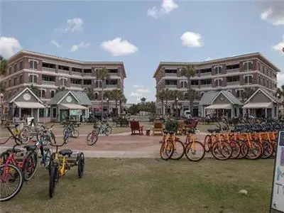 a bunch of bikes parked in front of buildings at Village of South Walton B377-G in Rosemary Beach