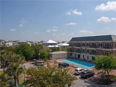 a large building with a pool and a parking lot at Village of South Walton B377-G in Rosemary Beach