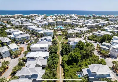 an aerial view of a city with houses and the ocean at The Crown Jewel of Seacrest Beach in Inlet Beach