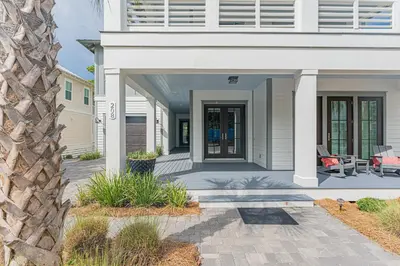 a front porch of a house with a patio at The Crown Jewel of Seacrest Beach in Inlet Beach