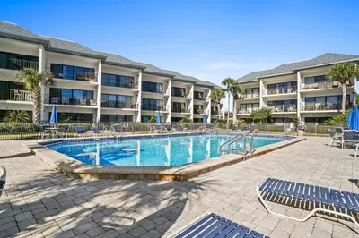 a swimming pool in front of a resort at 30A Emerald Hill Beach Resort by Panhandle Getaways in Santa Rosa Beach