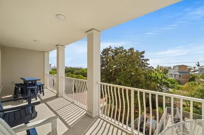 a balcony with chairs and a table with a view at 30A Villas at Seagrove by Panhandle Getaways in Santa Rosa Beach