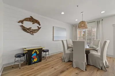 a dining room with a table and chairs at 30A Villas at Seagrove by Panhandle Getaways in Santa Rosa Beach