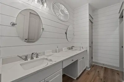 a white bathroom with two sinks and a mirror at 30A Villas at Seagrove by Panhandle Getaways in Santa Rosa Beach