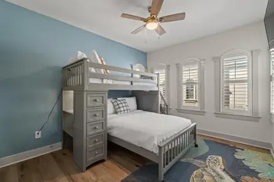 a bedroom with a bunk bed and a ceiling fan at 30A Villas at Seagrove by Panhandle Getaways in Santa Rosa Beach
