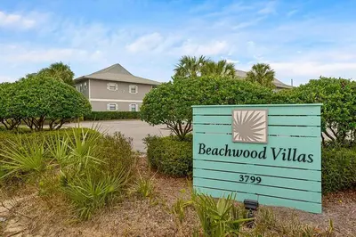 a sign for beachwood villas in front of a house at Beachwood Villas 1A- Beach Haven in Santa Rosa Beach