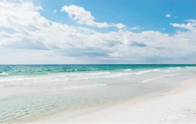 a sandy beach with the ocean in the background at Beachwood Villas 1A- Beach Haven in Santa Rosa Beach