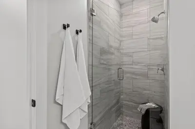 a bathroom with a shower with white towels at 30A Beach House - Casa Brisa in Inlet Beach