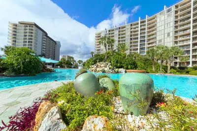 a resort swimming pool with two large buildings at Edgewater Tower 3-1012 in Panama City Beach
