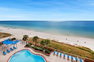 an overhead view of the beach and pool at a resort at Sunrise Beach #903 in Panama City Beach