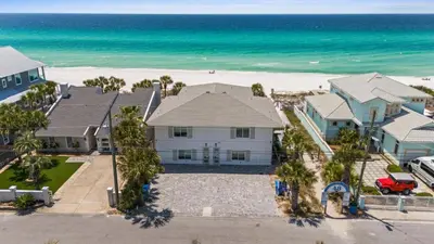an aerial view of a house and the beach at Beach House - Family Tides by Panhandle Getaways in Panama City Beach