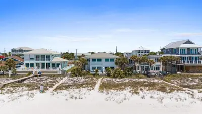 a row of houses on the beach at Beach House - Family Tides by Panhandle Getaways in Panama City Beach