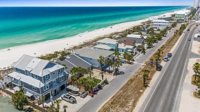 an aerial view of a beach with houses and the ocean at Beach House - Family Tides by Panhandle Getaways in Panama City Beach