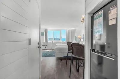 a room with a view of a bedroom with a bed at Top of the Gulf 807 in Panama City Beach