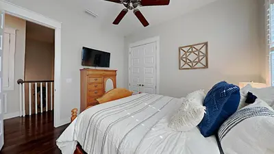 a bedroom with a bed and a ceiling fan at Prominece 30A - Beach Retreat in Santa Rosa Beach