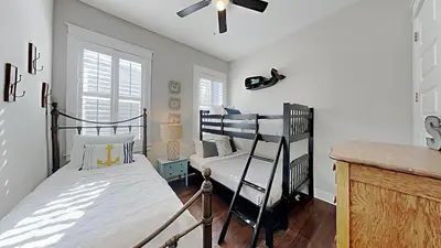a bedroom with two bunk beds and a ceiling fan at Prominece 30A - Beach Retreat in Santa Rosa Beach