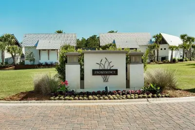 a building with a sign in front of a house at Prominece 30A - Coasting Inn in Watersound Beach
