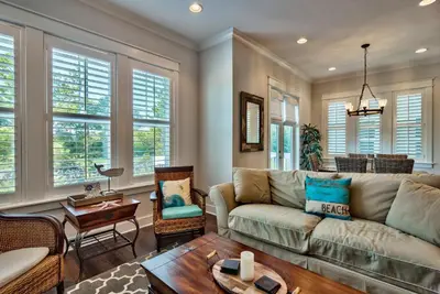 a living room with a couch and a table at Prominece 30A - Coasting Inn in Watersound Beach