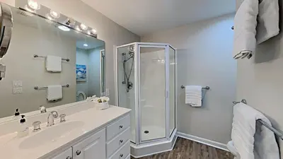 a bathroom with a shower and a sink at Beach Happy - Gulf Front in Santa Rosa Beach