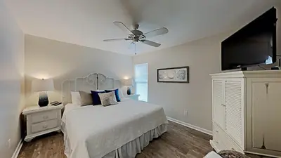 a bedroom with a bed and a ceiling fan at Beach Happy - Gulf Front in Santa Rosa Beach