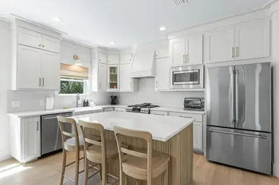 a kitchen with white cabinets and a white counter top at 26 Blue Coast Ct in Inlet Beach