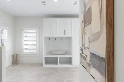a white room with white cabinets and a window at 26 Blue Coast Ct in Inlet Beach