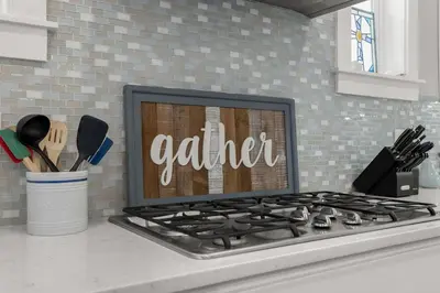 a kitchen counter with a stove top with the word alert at Sea Haven At Prominence in Watersound Beach