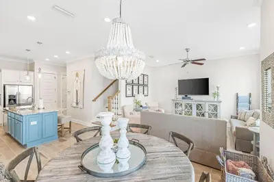 a dining room and living room with a dining table at Prominence 30A - TipSea Kitty in Santa Rosa Beach