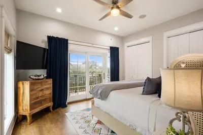 a bedroom with a bed and a window at Paradise Found on 30A in Santa Rosa Beach