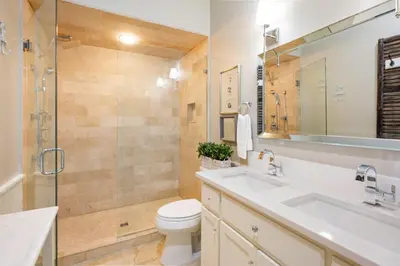 a bathroom with a shower and a toilet and a sink at Paradise Found on 30A in Santa Rosa Beach