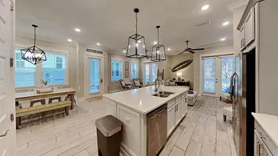 a large kitchen with a sink and a counter at Prominence 30A - Hey Hey 30A in Inlet Beach