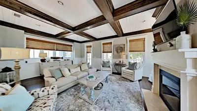 a living room with a couch and a fireplace at Pines and Palmettos in Santa Rosa Beach