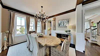 a dining room with a wooden table and chairs at Pines and Palmettos in Santa Rosa Beach